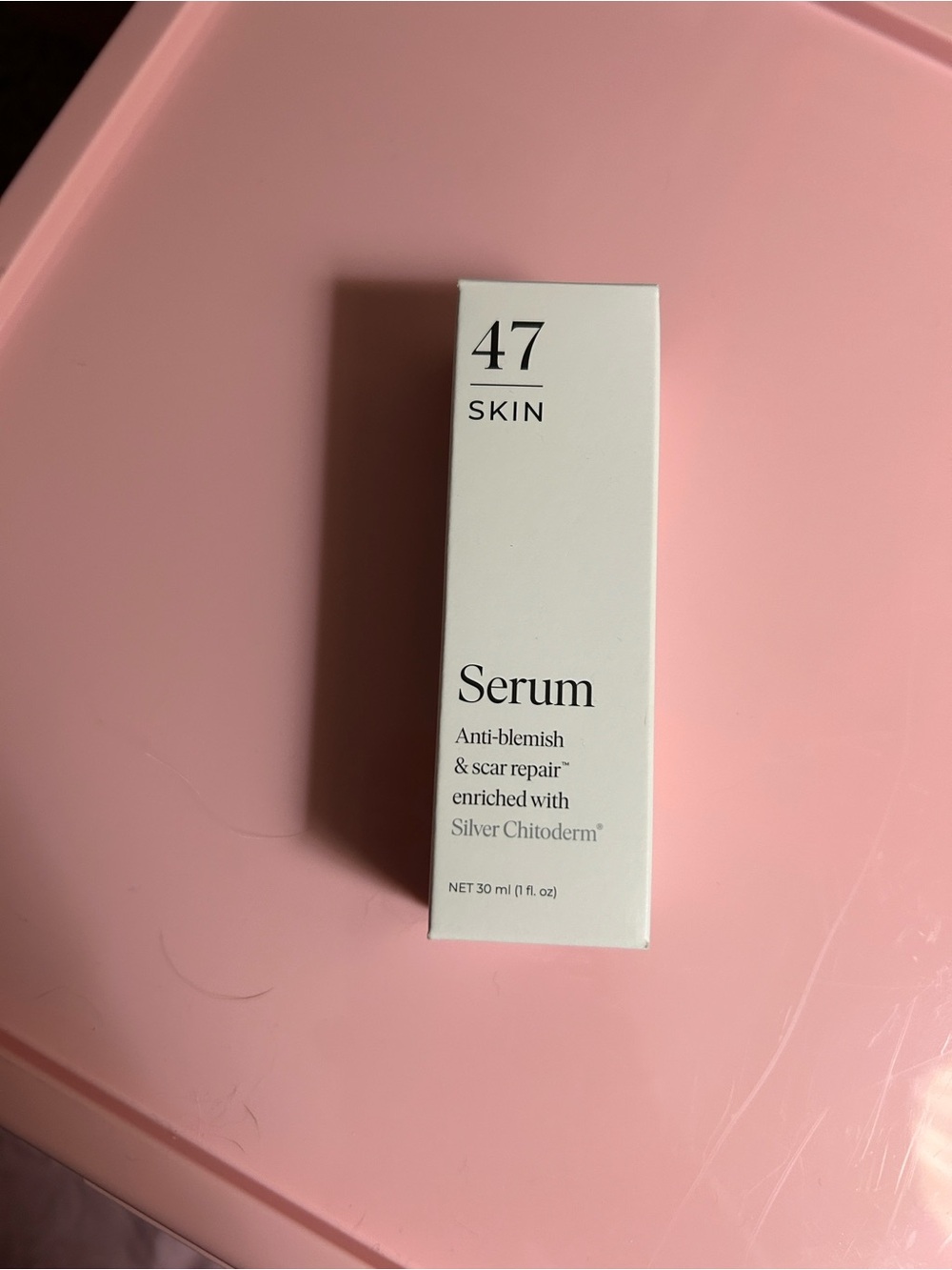 Skin Serum in Pink and White Box